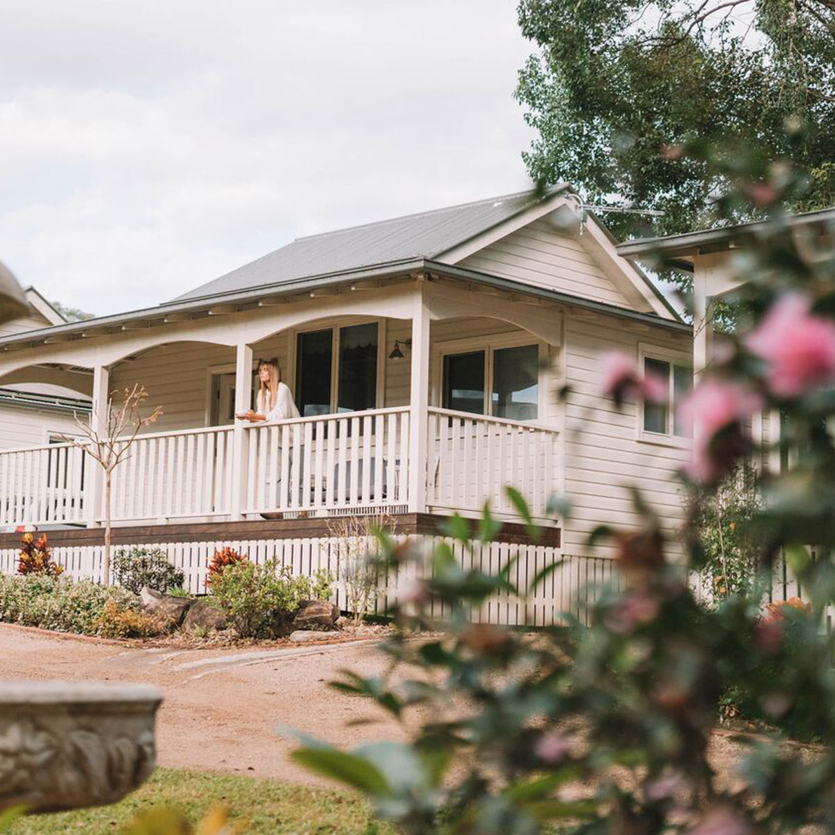 Bridal party enjoying garden views outside the self-contained cottages at Bangalow Guesthouse