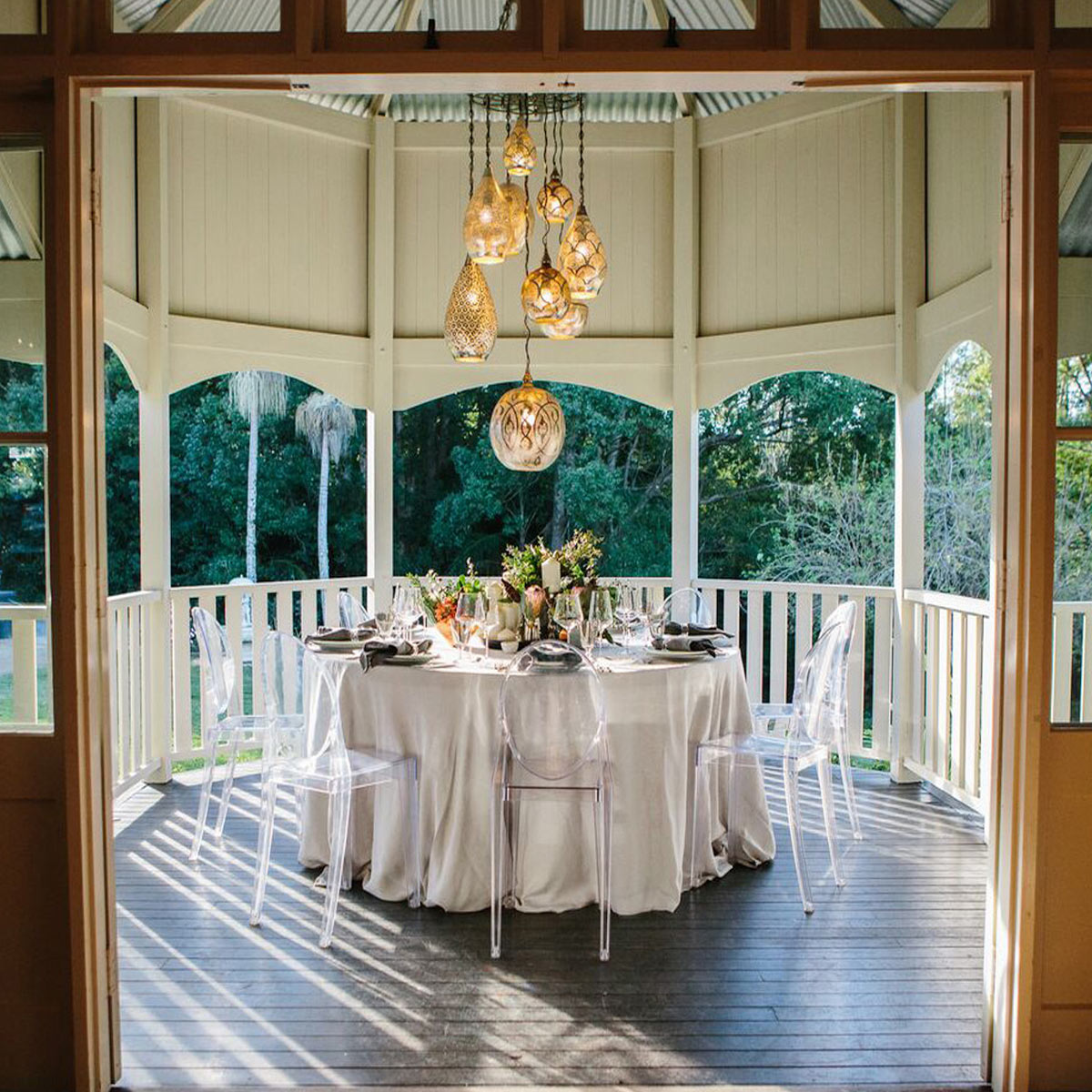 Vintage wedding details on the sweeping verandah surrounded by lush gardens at Bangalow Guesthouse