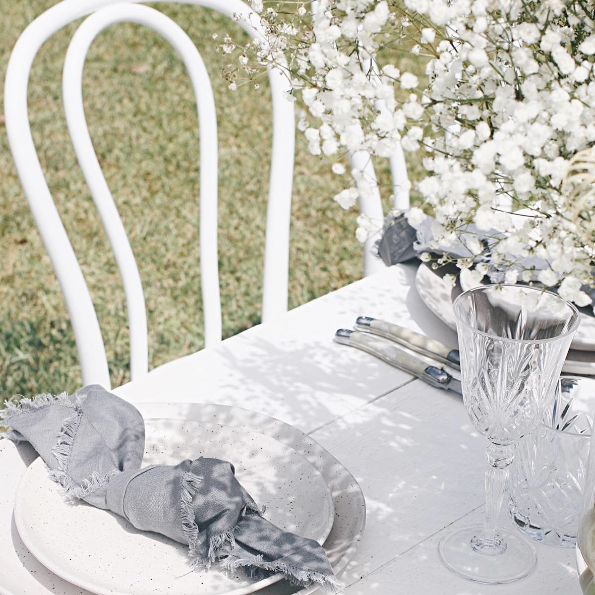 Vintage-style wedding table setting with floral arrangements at Bangalow Guesthouse