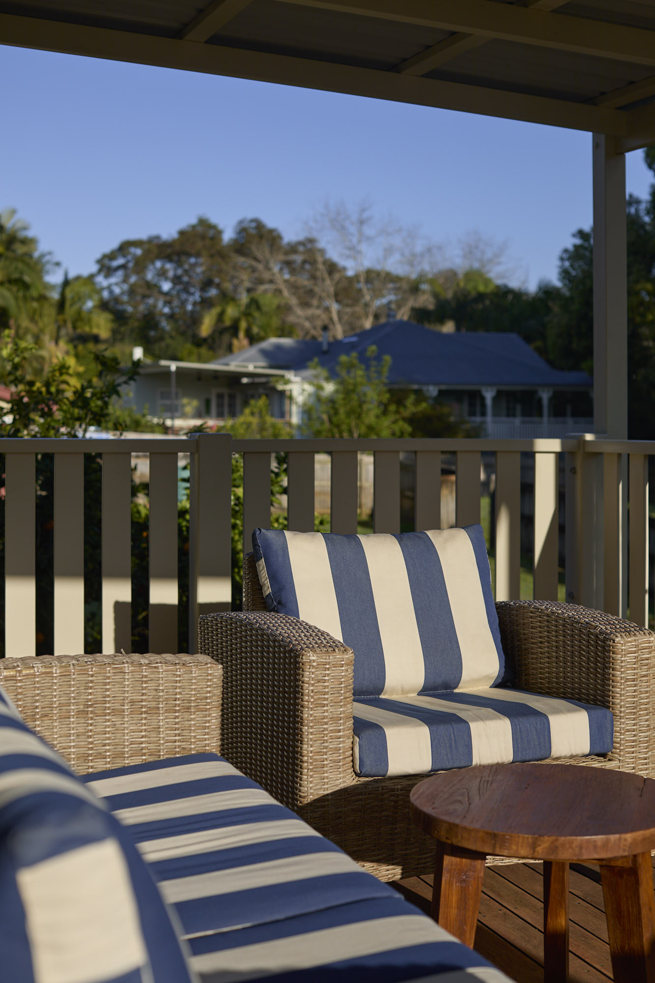 Miller Apartment balcony seating with peaceful hinterland views at Bangalow Guesthouse, just 20 minutes from Byron Bay