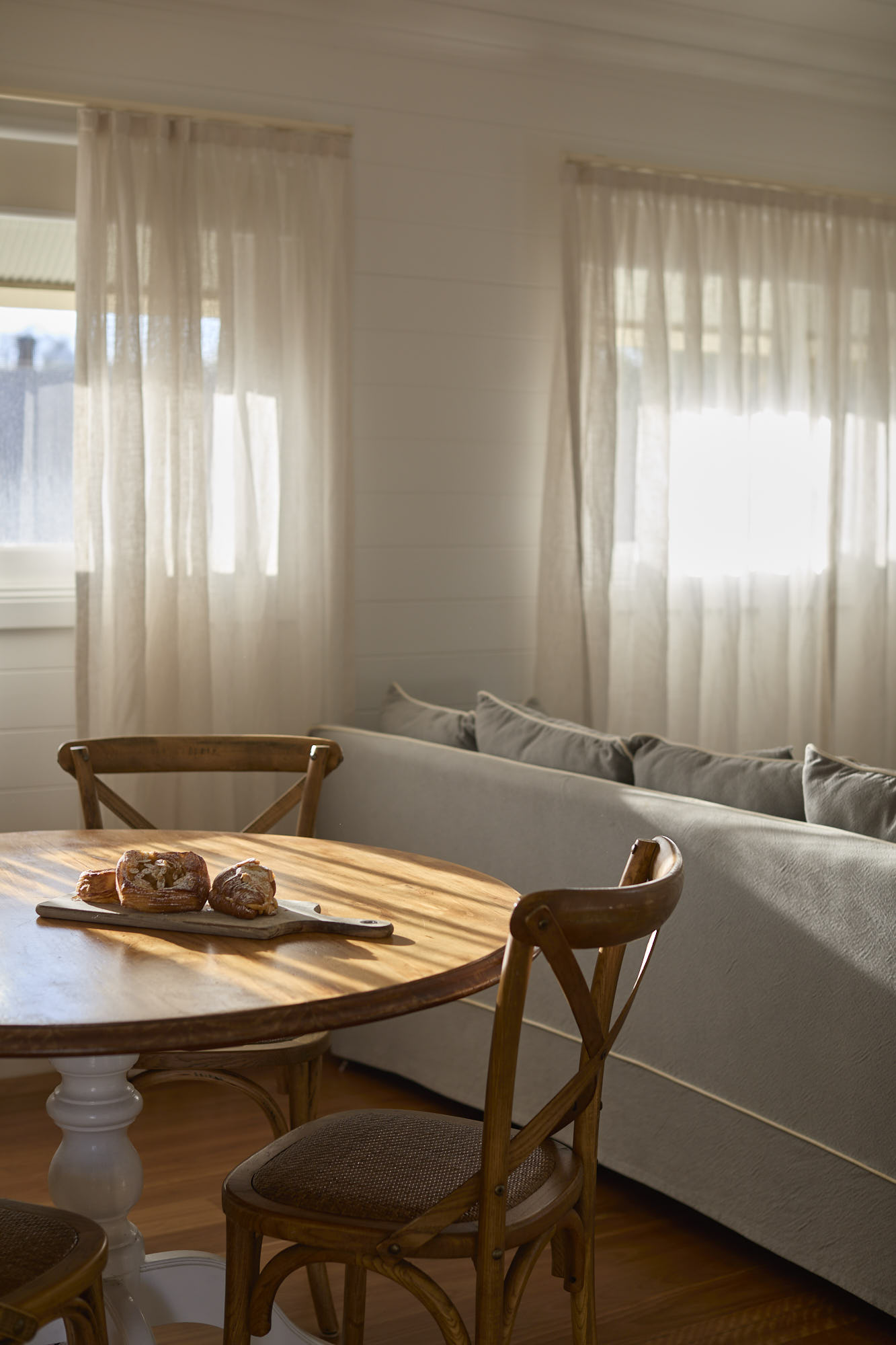 Miller Apartment at Bangalow Guesthouse featuring kitchenette, dining area, and private balcony in the Byron Bay hinterland
