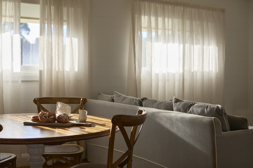 Miller Apartment dining area inside Bangalow Guesthouse with kitchenette and heritage charm near Byron Bay hinterland