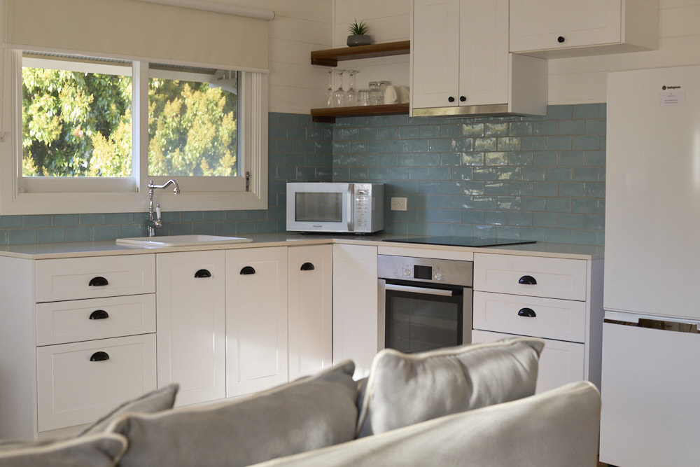 Miller Apartment kitchenette with dining area at Bangalow Guesthouse near Byron Bay hinterland