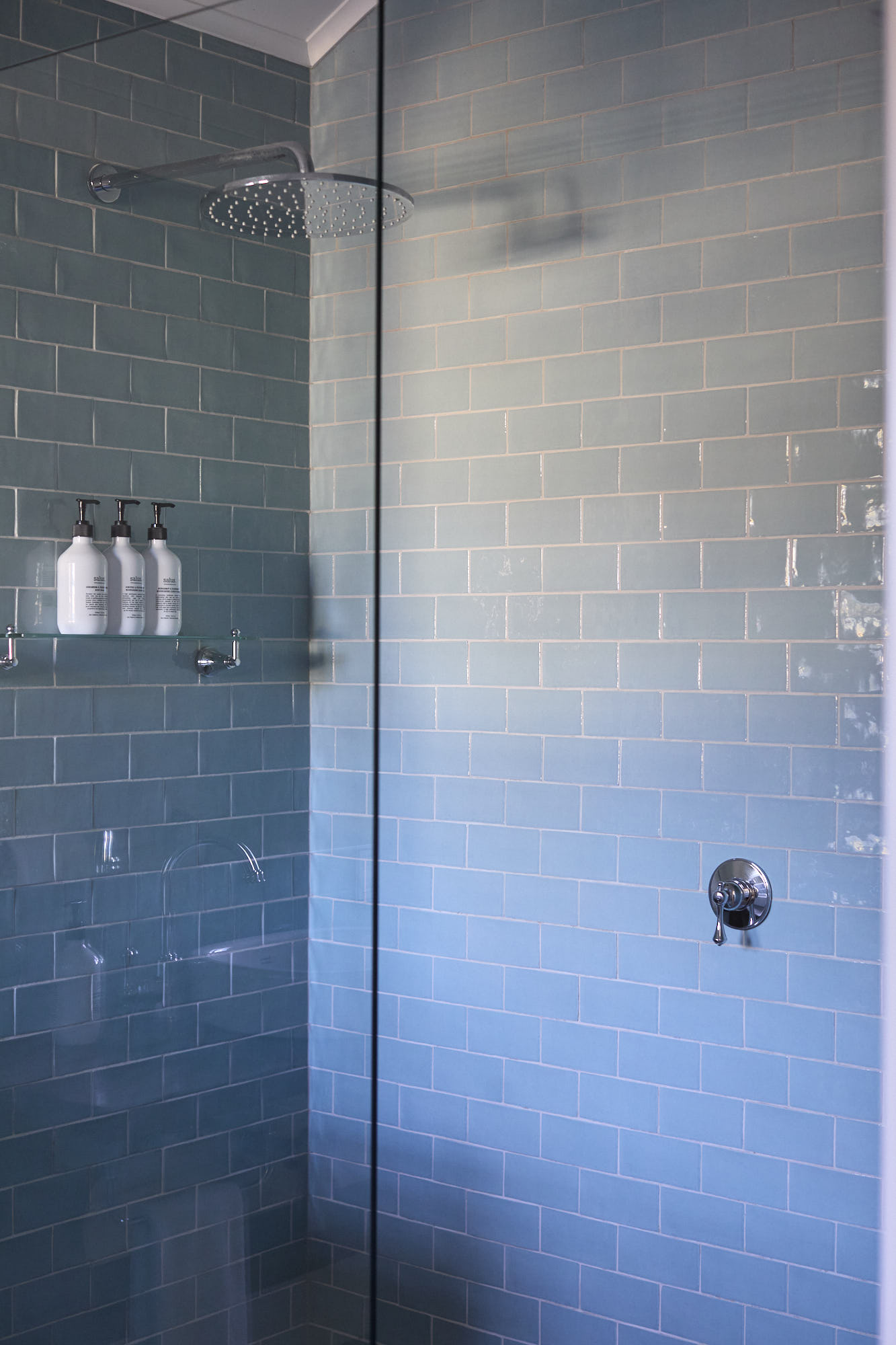 Miller Apartment ensuite bathroom with luxurious rainforest showerhead at Bangalow Guesthouse near Byron Bay