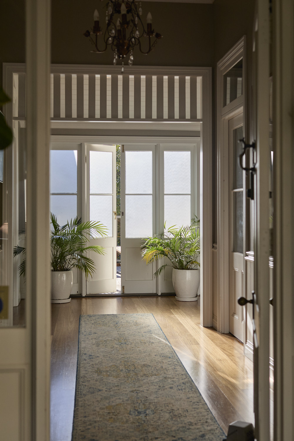 Heritage entrance foyer at The Bangalow Guesthouse with original architectural details and elegant styling