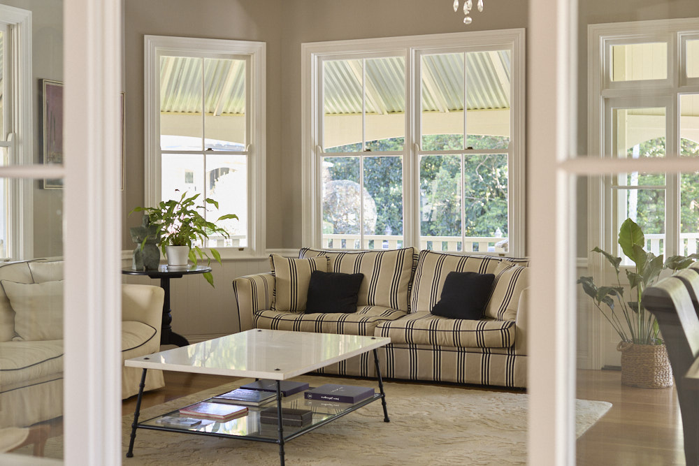 Heritage-style guest lounge at The Bangalow Guesthouse with elegant furnishings and natural light