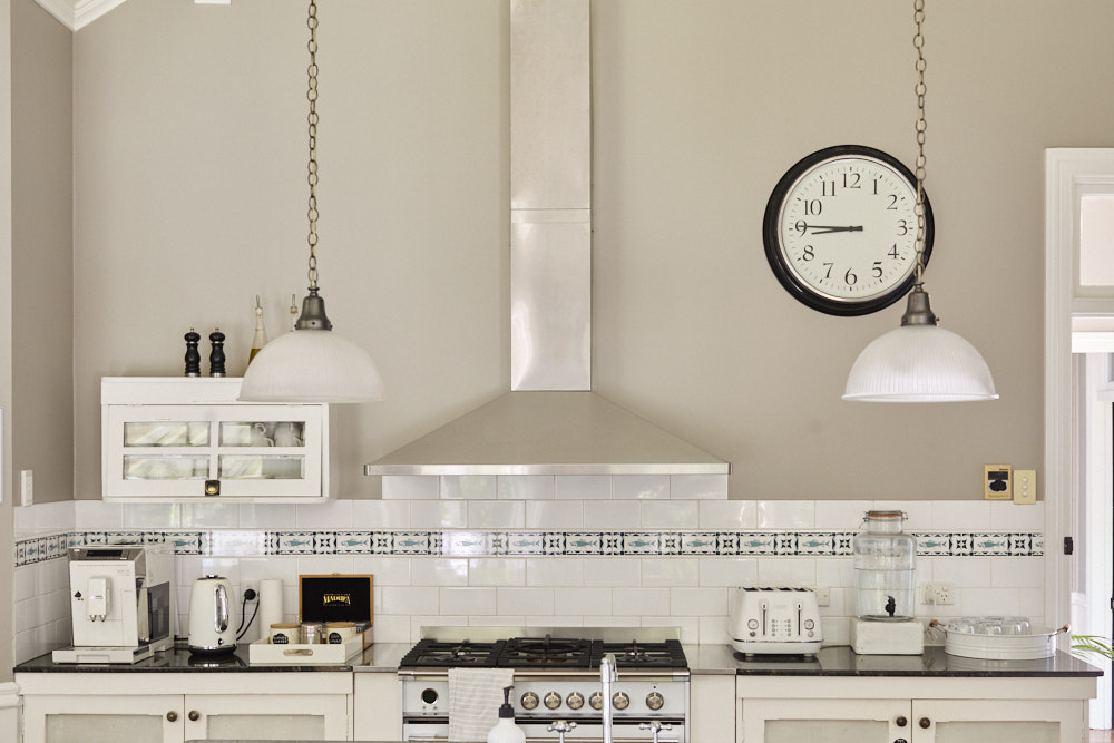 Country-style kitchen at The Bangalow Guesthouse with heritage details and modern amenities