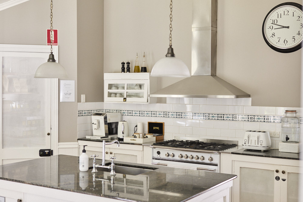 Country-style kitchen at The Bangalow Guesthouse with heritage details and modern amenities