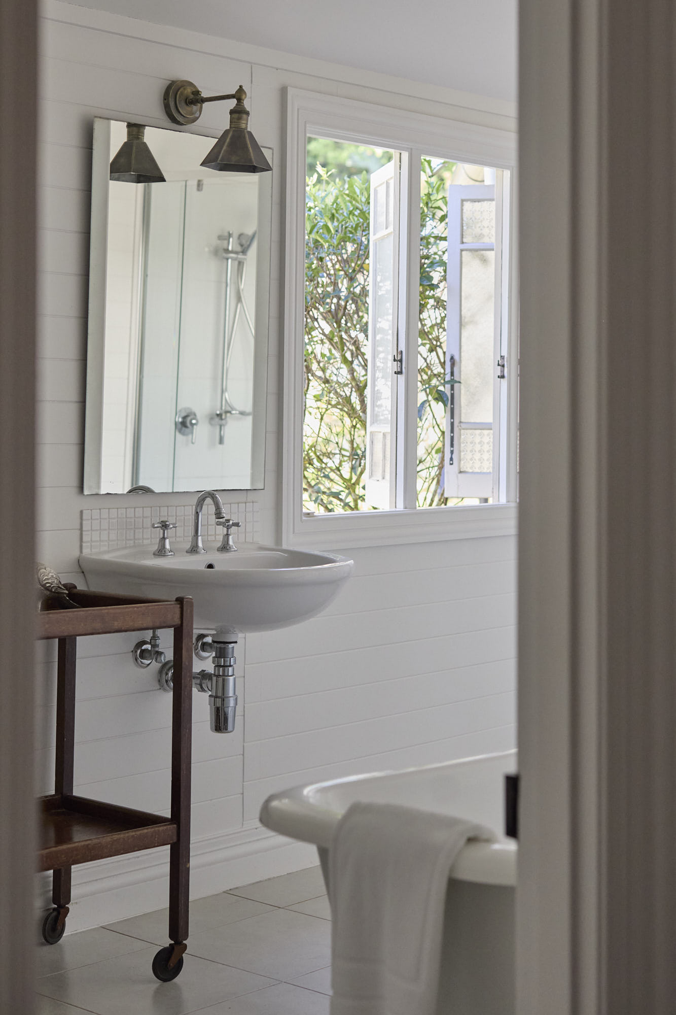 Dr Stewart Suite clawfoot bath in a warm white ensuite at Bangalow Guesthouse, perfect for a relaxing hinterland retreat