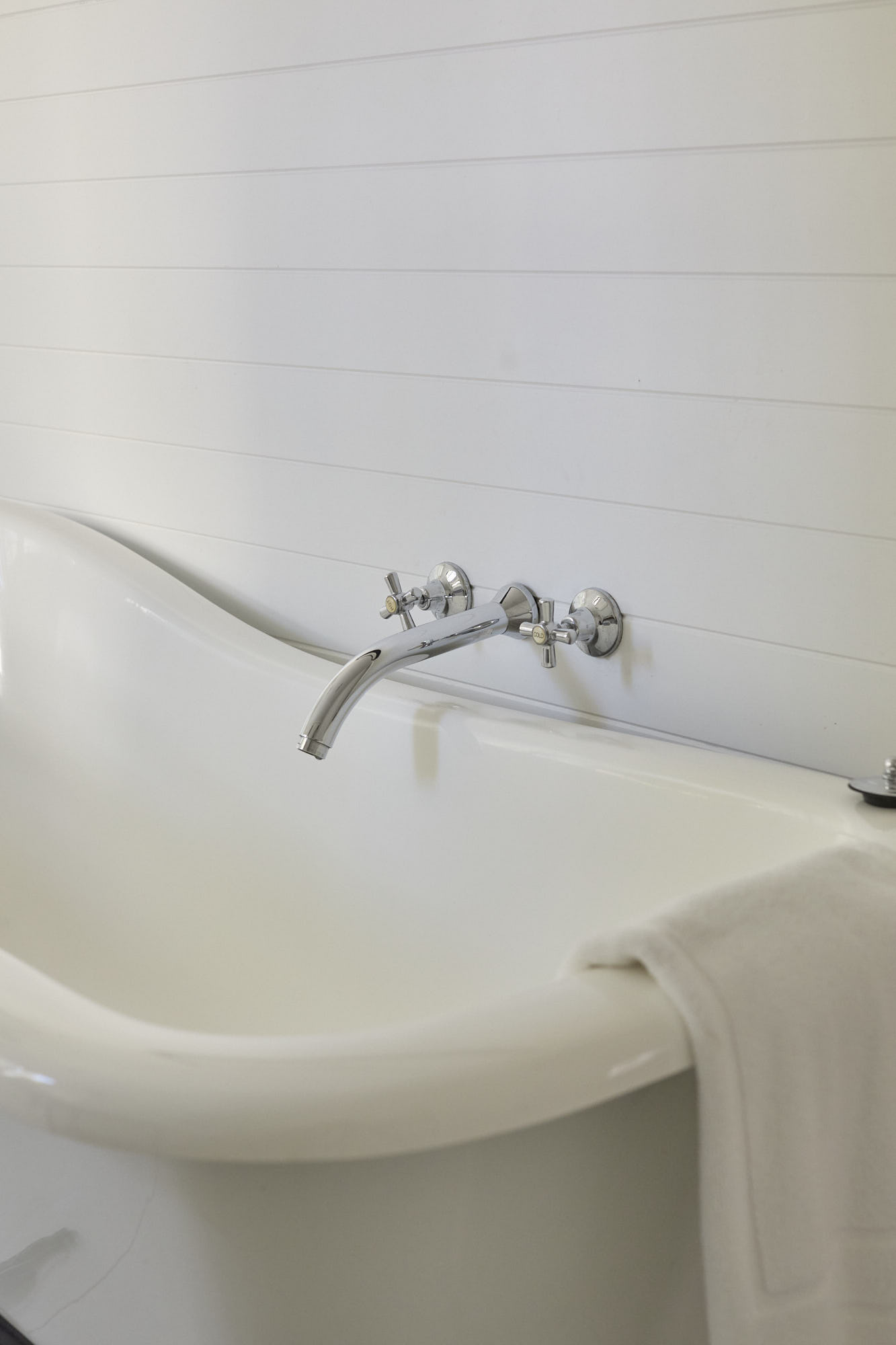 Elegant clawfoot bath in the Dr Stewart Suite ensuite at Bangalow Guesthouse, a peaceful Byron Bay hinterland escape