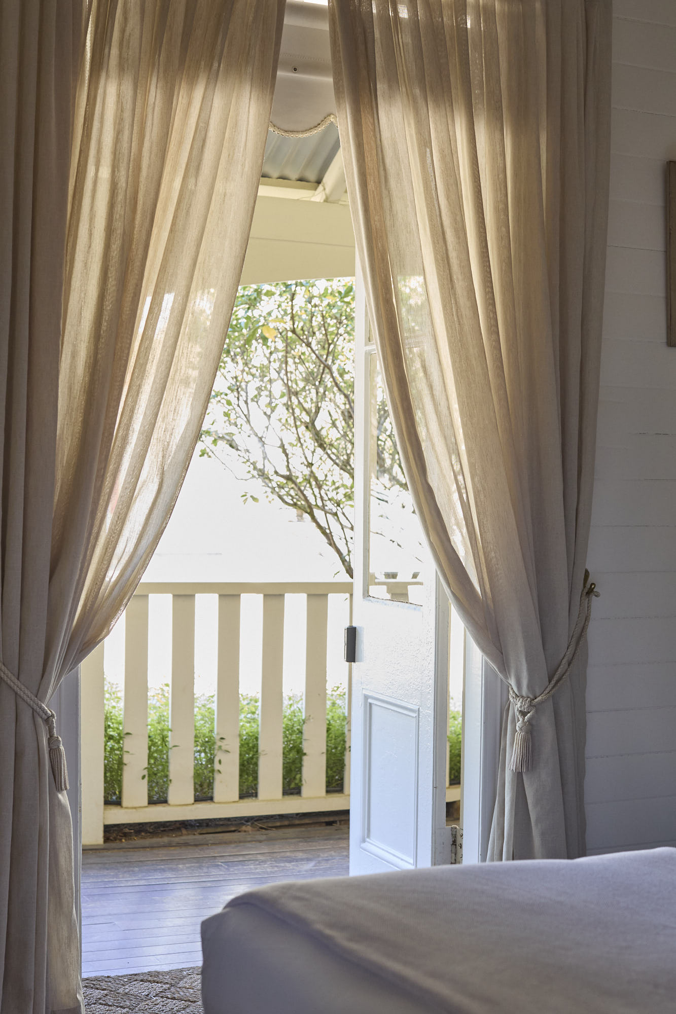 Joseph Snow Suite French doors opening onto shared heritage veranda at Bangalow Guesthouse